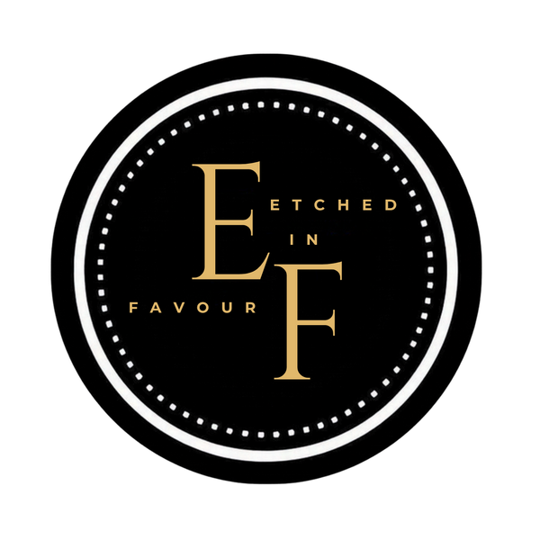 A circular black and white logo with gold lettering that ETCHED IN FAVOUR.