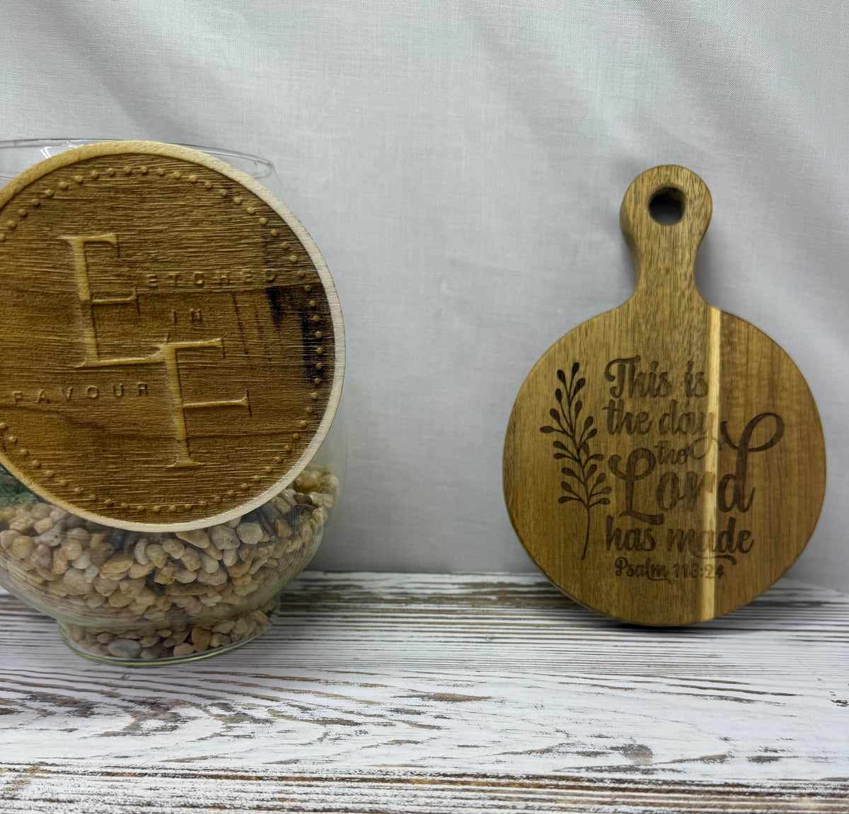 Add faith and beauty to your home with this stunning laser-engraved round mini board featuring the uplifting scripture from Psalm 118:24: “This is the day the Lord has made.” from Etched in Favour